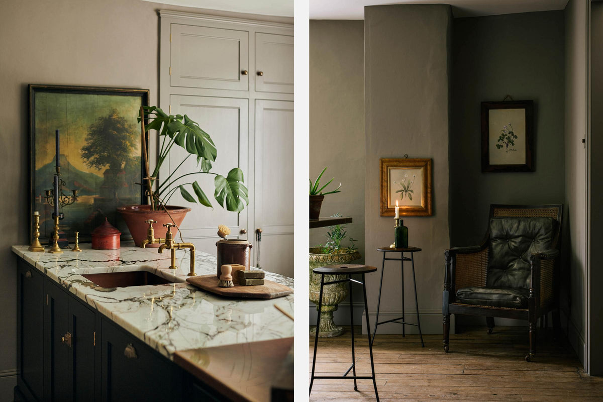 A printer’s black Shaker kitchen featuring a kitchen island with a San Simone quartzite worktop, a copper sink, and aged brass Mayan taps. Adorned with vintage furniture, artisan ceramics, lush flora and fauna, and antique memorabilia, it creates a classic, chic kitchen with a touch of personality.